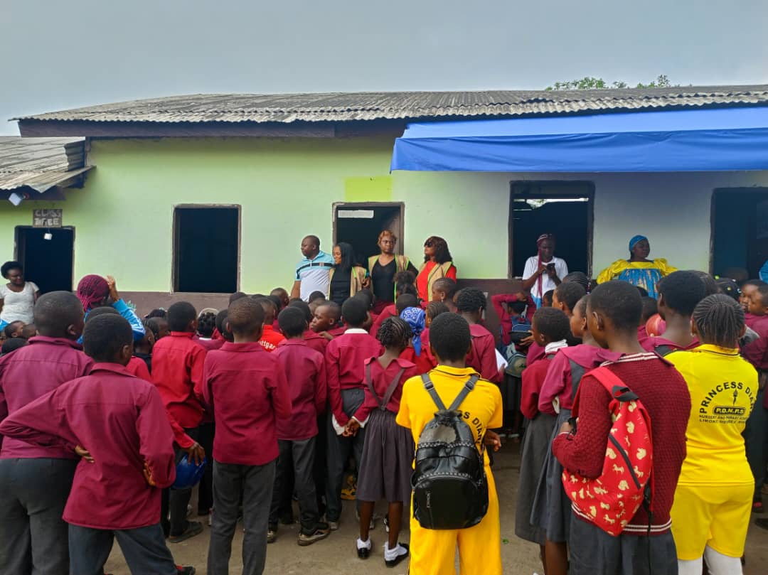 Children receiving academic excellence prizes at the Bokwaongo primary school
